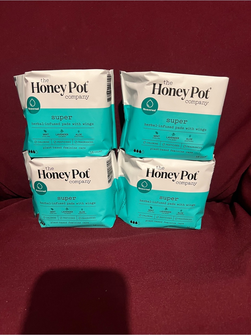 4 Pack of The Honey Pot Company Super-Herbal infused pads with wigs
